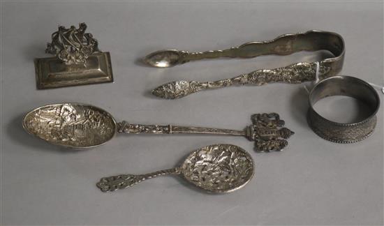 An ornate pair of William IV silver sugar tongs, London, 1834, A Hanau whit emetal spoon, silver spoon by Saunders & Shepherd etc.